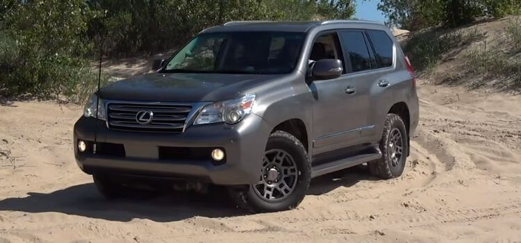 2012 Lexus GX 460 on sand with Cooper Discoverer AT3 4S tires showcasing all-terrain capability.